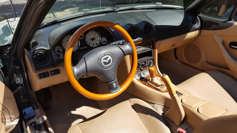 Wheel, shift knob, hand brake handle, and dash accents by Nardi